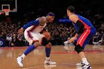 NEW YORK, NY - JANUARY 31:  Carmelo Anthony #7 of the New York Knicks drives against Austin Daye #5 of the Detroit Pistons at Madison Square Garden on January 31, 2012 in New York City.  NOTE TO USER: User expressly acknowledges and agrees that, by downloading and or using this photograph, User is consenting to the terms and conditions of the Getty Images License Agreement. (Photo by Chris Trotman/Getty Images)