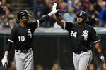 CLEVELAND, OH - SEPTEMBER 20: Alexei Ramirez #10 and Dayan Viciedo #24 of the Chicago White Sox celebrate after scoring on double hit by Alejandro De Aza #30 (not shown) during the sixth inning against the Cleveland Indians at Progressive Field on September 20, 2011 in Cleveland, Ohio. (Photo by Jason Miller/Getty Images)