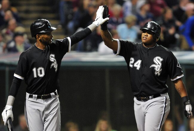 CLEVELAND, OH - SEPTEMBER 20: Alexei Ramirez #10 and Dayan Viciedo #24 of the Chicago White Sox celebrate after scoring on double hit by Alejandro De Aza #30 (not shown) during the sixth inning against the Cleveland Indians at Progressive Field on September 20, 2011 in Cleveland, Ohio. (Photo by Jason Miller/Getty Images)