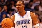 ORLANDO, FL - FEBRUARY 06:  Dwight Howard #12 of the Orlando Magic smiles during the game against the Los Angeles Clippers at Amway Center on February 6, 2012 in Orlando, Florida.   NOTE TO USER: User expressly acknowledges and agrees that, by downloading and or using this Photograph, user is consenting to the terms and conditions of the Getty Images License Agreement.  (Photo by Sam Greenwood/Getty Images)