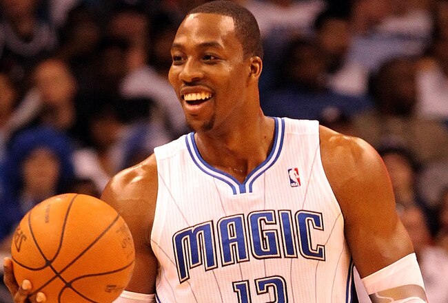 ORLANDO, FL - FEBRUARY 06:  Dwight Howard #12 of the Orlando Magic smiles during the game against the Los Angeles Clippers at Amway Center on February 6, 2012 in Orlando, Florida.   NOTE TO USER: User expressly acknowledges and agrees that, by downloading and or using this Photograph, user is consenting to the terms and conditions of the Getty Images License Agreement.  (Photo by Sam Greenwood/Getty Images)