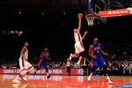 NEW YORK, NY - JANUARY 31:  Jeremy Lin #17 of the New York Knicks lays the ball up over Damien Wilkins #9 of the Detroit Pistons at Madison Square Garden on January 31, 2012 in New York City.  NOTE TO USER: User expressly acknowledges and agrees that, by downloading and or using this photograph, User is consenting to the terms and conditions of the Getty Images License Agreement. (Photo by Chris Trotman/Getty Images)
