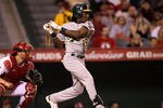 ANAHEIM, CA - SEPTEMBER 24:  Jemile Weeks #19 of the Oakland Athletics hits an RBI single in the fifth inning against the Los Angeles Angels of Anaheim on September 24, 2011 at Angel Stadium in Anaheim, California.   (Photo by Stephen Dunn/Getty Images)
