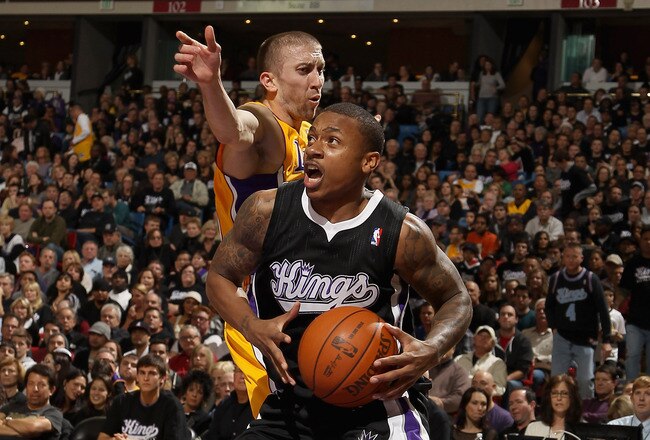 SACRAMENTO, CA - DECEMBER 26:  Isaiah Thomas #22 of the Sacramento Kings drives past Steve Blake #5 of the Los Angeles Lakers at Power Balance Pavilion on December 26, 2011 in Sacramento, California.  NOTE TO USER: User expressly acknowledges and agrees that, by downloading and or using this photograph, User is consenting to the terms and conditions of the Getty Images License Agreement.  (Photo by Ezra Shaw/Getty Images)