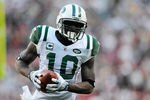 LANDOVER, MD - DECEMBER 04:  Santonio Holmes #10 of the New York Jets catches a 30 yard touchdown pass from Mark Sanchez #6 of the New York Jets against the Washington Redskins at FedExField on December 4, 2011 in Landover, Maryland.  (Photo by Patrick McDermott/Getty Images)