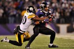 BALTIMORE, MD - DECEMBER 05:  T.J. Houshmandzadeh #84 of the Baltimore Ravens runs the ball against Bryant McFadden #20 of the Pittsburgh Steelers during the first half of the game at M&T Bank Stadium on December 5, 2010 in Baltimore, Maryland. Pittsburgh won 13-10.  (Photo by Larry French/Getty Images)