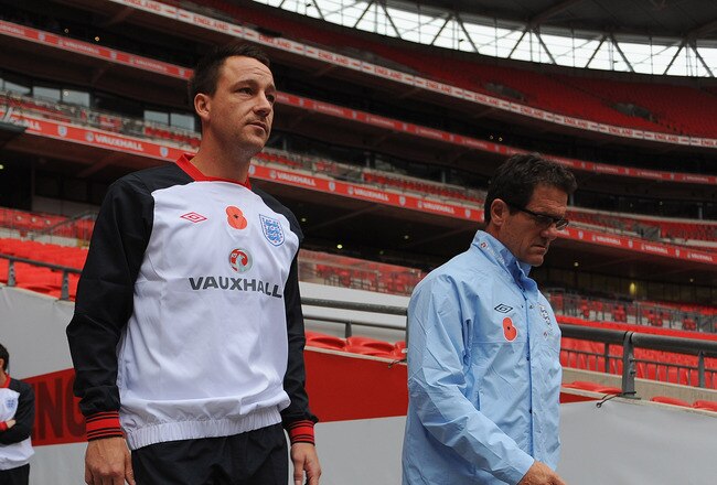 LONDON, ENGLAND - NOVEMBER 11: England manager Fabio Capello and John Terry lead out the team before their training session at Wembley Stadium on November 11, 2011 in London, England.  (Photo by Michael Regan/Getty Images)