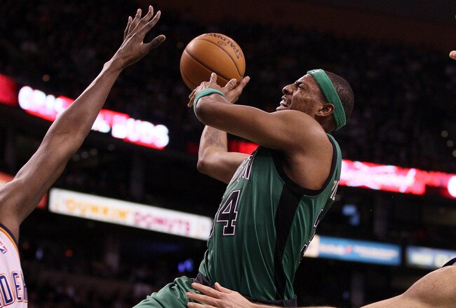 BOSTON, MA - JANUARY 16:  Paul Pierce #34 of the Boston Celtics tries to take a shot as Nazr Mohammed #8 of the Oklahoma City Thunder defends on January 16, 2012 at TD Garden in Boston, Massachusetts. NOTE TO USER: User expressly acknowledges and agrees that, by downloading and or using this photograph, User is consenting to the terms and conditions of the Getty Images License Agreement.  (Photo by Elsa/Getty Images)