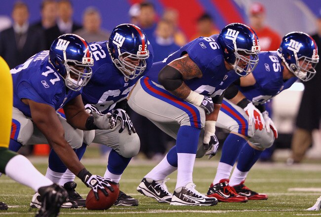 EAST RUTHERFORD, NJ - DECEMBER 04:  Offensive linemen center Kevin Boothe #77, guard Mitch Petrus #62, tackle David Diehl #66 and tight end Jake Ballard #85 of the New York Giants line up in their stance against the Green Bay Packers at MetLife Stadium on December 4, 2011 in East Rutherford, New Jersey.  (Photo by Al Bello/Getty Images)