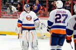 WASHINGTON, DC - JANUARY 17:  Evgeni Nabokov #20 of the New York Islanders is congratulated by teammates after a 3-0 victory against the Washington Capitals at the Verizon Center on January 17, 2012 in Washington, DC.  (Photo by Greg Fiume/Getty Images)