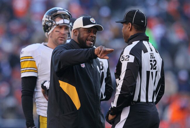 DENVER, CO - JANUARY 08:  Head coach Mike Tomlin of the Pittsburgh Steelers talks with a referee during the AFC Wild Card Playoff game against the Denver Broncos at Sports Authority Field at Mile High on January 8, 2012 in Denver, Colorado.  (Photo by Jeff Gross/Getty Images)