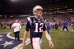 INDIANAPOLIS, IN - FEBRUARY 05:  Tom Brady #12 of the New England Patriots walks off the field after losing to the New York Giants by a score of 21-17 in Super Bowl XLVI at Lucas Oil Stadium on February 5, 2012 in Indianapolis, Indiana.  (Photo by Ezra Shaw/Getty Images)