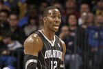OKLAHOMA CITY, OK - DECEMBER 25:  Dwight Howard #12 of the Orlando Magic questions a call during the NBA season opening game against the Oklahoma City Thunder December 25, 2011 at the Chesapeake Energy Arena in Oklahoma City, Oklahoma.  Oklahoma City defeated Orlando 97-89. NOTE TO USER: User expressly acknowledges and agrees that, by downloading and or using this Photograph, user is consenting to the terms and conditions of the Getty Images License Agreement.  (Photo by Brett Deering/Getty Images)