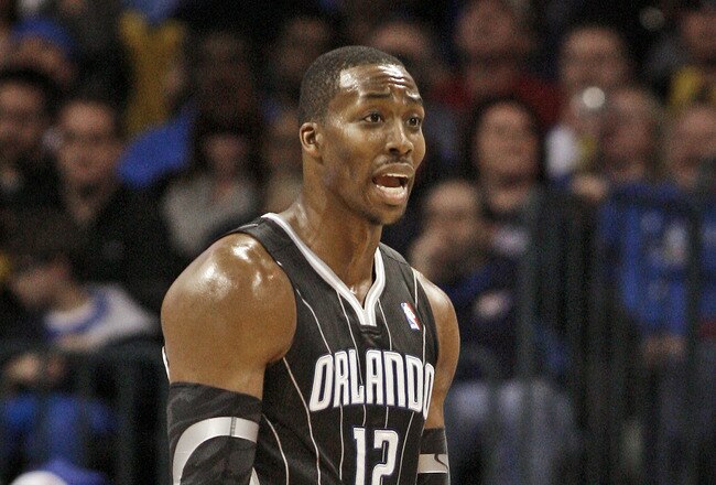 OKLAHOMA CITY, OK - DECEMBER 25:  Dwight Howard #12 of the Orlando Magic questions a call during the NBA season opening game against the Oklahoma City Thunder December 25, 2011 at the Chesapeake Energy Arena in Oklahoma City, Oklahoma.  Oklahoma City defeated Orlando 97-89. NOTE TO USER: User expressly acknowledges and agrees that, by downloading and or using this Photograph, user is consenting to the terms and conditions of the Getty Images License Agreement.  (Photo by Brett Deering/Getty Images)