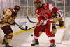 BOSTON - JANUARY 08:  Cam Atkinson #13 of the Boston College Eagles and Kevin Shattenkirk #3 of the Boston University Terriers fight for the puck on January 8, 2010 during the Sun Life Frozen Fenway Hockey Game at the Fenway Park in Boston, Massachusetts.  (Photo by Elsa/Getty Images)