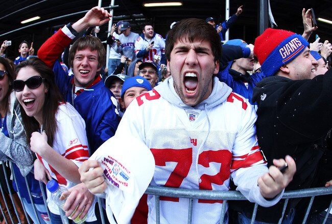 NEW YORK, NY - FEBRUARY 07:  New York Giants fans cheer during the New York Giants ticker tape victory parade down the Canyon of Heros on February 7, 2012 in New York City.  The Giants defeated the New England Patriots 21-17 in Super Bowl XLVI at Lucas Oil Stadium on February 5, 2012 in Indianapolis, Indiana.  (Photo by Al Bello/Getty Images)