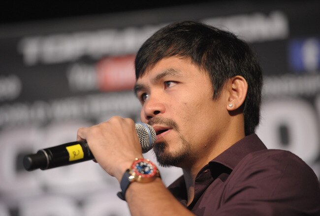 NEW YORK, NY - SEPTEMBER 06:  Professional Boxer Manny Pacquiao (pictured) sings during the press conference for his World Welterweight Championship Fight with Juan Manuel Marquez at The Lighthouse at Chelsea Piers on September 6, 2011 in New York City.  (Photo by Michael Loccisano/Getty Images)