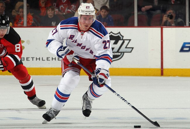 NEWARK, NJ - JANUARY 31: Ryan McDonagh #27 of the New York Rangers skates against the New Jersey Devils at the Prudential Center on January 31, 2012 in Newark, New Jersey. The Devils defeated the Rangers 4-3 in the shootout.  (Photo by Bruce Bennett/Getty Images)