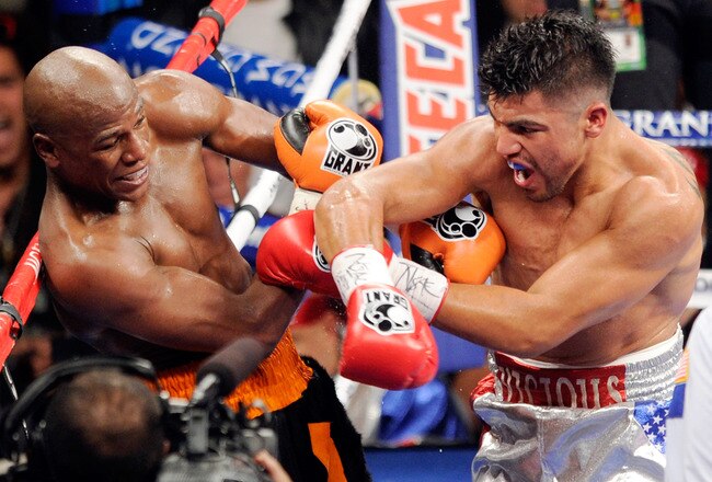 LAS VEGAS, NV - SEPTEMBER 17:  Floyd Mayweather Jr. (L) and Victor Ortiz battle in the fourth round of their WBC welterweight title fight at the MGM Grand Garden Arena September 17, 2011 in Las Vegas, Nevada. Mayweather knocked out Ortiz in the fourth round to win the title.  (Photo by Ethan Miller/Getty Images)