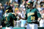 OAKLAND, CA - SEPTEMBER 03: Kurt Suzuki #8 and Brandon McCarthy #32 of the Oakland Athletics celebrate defeating the Seattle Mariners 3 to 0 during an MLB baseball game at O.co Coliseum on September 3, 2011 in Oakland, California.  (Photo by Thearon W. Henderson/Getty Images)