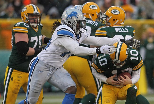 GREEN BAY, WI - JANUARY 01:  Willie Young #79 of the Detroit Lions sacks Matt Flynn #10 of the Green Bay Packers at Lambeau Field on January 1, 2012 in Green Bay, Wisconsin. The Packers defeated the Lions 45-41.  (Photo by Jonathan Daniel/Getty Images)