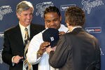 DETROIT, MI - JANUARY 26:  Prince Fielder #28 of the Detroit Tigers puts on his jersey, helped by CEO and general manager Dave Dombrowski (L) and owner Mike Ilitch during a press conference at Comerica Park on January 26, 2012 in Detroit, Michigan.  (Photo by Jorge Lemus/Getty Images)