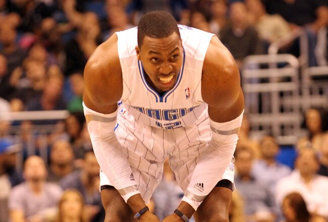 ORLANDO, FL - FEBRUARY 06:  Dwight Howard #12 of the Orlando Magic grimmaces during the game against the Los Angeles Clippers at Amway Center on February 6, 2012 in Orlando, Florida.   NOTE TO USER: User expressly acknowledges and agrees that, by downloading and or using this Photograph, user is consenting to the terms and conditions of the Getty Images License Agreement.  (Photo by Sam Greenwood/Getty Images)