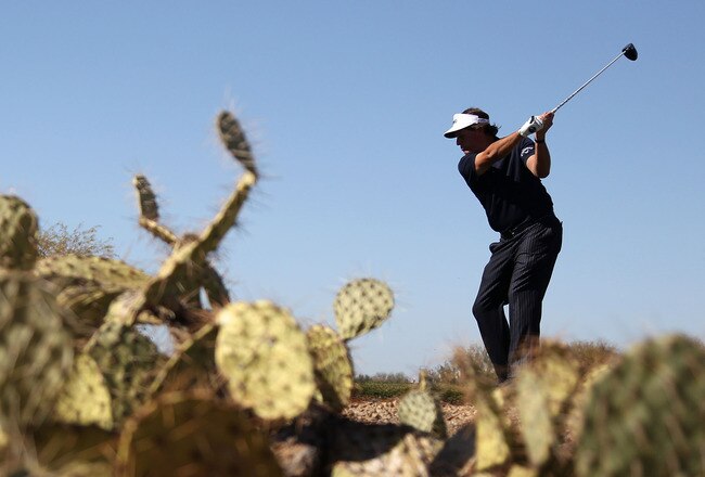 SCOTTSDALE, AZ - FEBRUARY 05:  Phil Mickelson hits a tee shot on the 11th hole during the final round of the Waste Management Phoenix Open at TPC Scottsdale on February 5, 2012 in Scottsdale, Arizona.  (Photo by Christian Petersen/Getty Images)