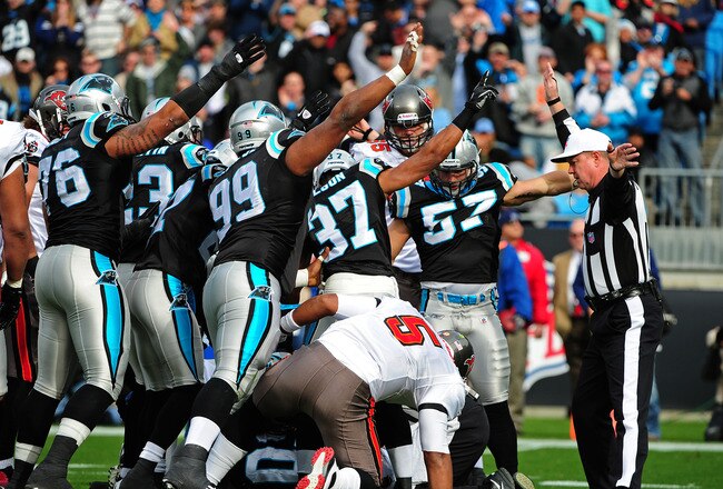 CHARLOTTE, NC - DECEMBER 24: Members of the Carolina Panthers signal after recovering a fumble by Josh Freeman #5 of the Tampa Bay Buccaneers at Bank of America Stadium on December 24, 2011 in Charlotte, North Carolina  (Photo by Scott Cunningham/Getty Images)