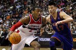 WASHINGTON, DC - FEBRUARY 08:  John Wall #2 of the Washington Wizards drives against Jeremy Lin #17 of the New York Knicks during the second half at Verizon Center on February 8, 2012 in Washington, DC.  NOTE TO USER: User expressly acknowledges and agrees that, by downloading and or using this photograph, User is consenting to the terms and conditions of the Getty Images License Agreement.  (Photo by Rob Carr/Getty Images)