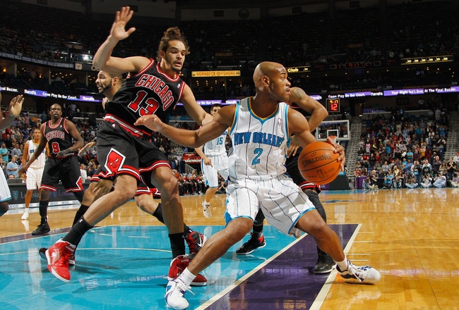NEW ORLEANS, LA - FEBRUARY 08:  Jarrett Jack #2 of the New Orleans Hornets drives the ball around Joakim Noah #13 of the Chicago Bulls at New Orleans Arena on February 8, 2012 in New Orleans, Louisiana.  NOTE TO USER: User expressly acknowledges and agrees that, by downloading and or using this photograph, User is consenting to the terms and conditions of the Getty Images License Agreement.  (Photo by Chris Graythen/Getty Images)