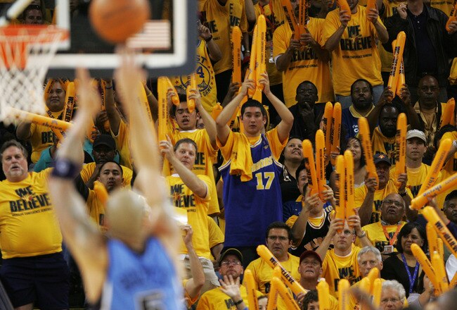 OAKLAND, CA - MAY 11:  Fans of the Golden State Warriors celebrate against the Utah Jazz in Game Three of the Western Conference Semifinals during the 2007 NBA Playoffs at Oracle Arena May 11, 2007 in Oakland, California. NOTE TO USER: User expressly acknowledges and agrees that, by downloading and or using this photograph, user is consenting to the terms and conditions of the Getty Images License Agreement.  (Photo by Justin Sullivan/Getty Images)