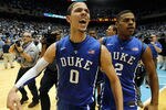 CHAPEL HILL, NC - FEBRUARY 08:  Austin Rivers #0 of the Duke Blue Devils celebrates with teammate Quinn Cook #2 after hitting a game-winning 3 pointer to defeat the North Carolina Tar Heels 85-84 during their game at the Dean Smith Center on February 8, 2012 in Chapel Hill, North Carolina.  (Photo by Streeter Lecka/Getty Images)