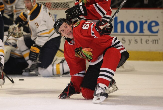 CHICAGO, IL - JANUARY 18:  Andrew Shaw #65 of the Chicago Blackhawks celebrates a first period goal against the Buffalo Sabres at the United Center on January 18, 2012 in Chicago, Illinois.  (Photo by Jonathan Daniel/Getty Images)
