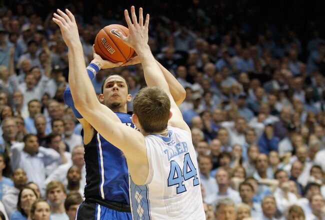 CHAPEL HILL, NC - FEBRUARY 08:  Austin Rivers #0 of the Duke Blue Devils shoots the game-winning 3 pointer over Tyler Zeller #44 to defeat the North Carolina Tar Heels 85-84 during their game at the Dean Smith Center on February 8, 2012 in Chapel Hill, North Carolina.  (Photo by Streeter Lecka/Getty Images)