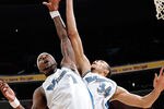 WASHINGTON, DC - DECEMBER 18:  JaVale McGee #34 and Andray Blatche #7 of the Washington Wizards jump for a rebound against the Miami Heat at the Verizon Center on December 18, 2010 in Washington, DC. NOTE TO USER: User expressly acknowledges and agrees that, by downloading and or using this Photograph, user is consenting to the terms and conditions of the Getty Images License Agreement.   (Photo by Greg Fiume/Getty Images)