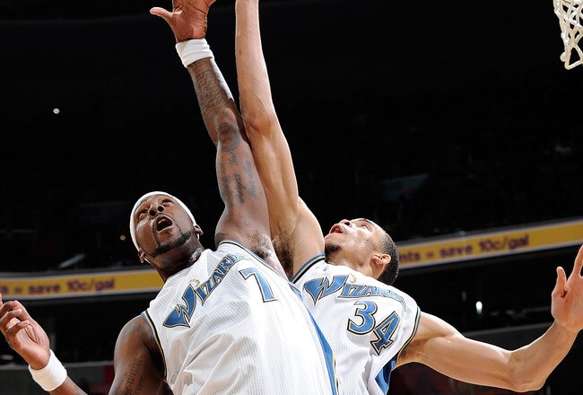WASHINGTON, DC - DECEMBER 18:  JaVale McGee #34 and Andray Blatche #7 of the Washington Wizards jump for a rebound against the Miami Heat at the Verizon Center on December 18, 2010 in Washington, DC. NOTE TO USER: User expressly acknowledges and agrees that, by downloading and or using this Photograph, user is consenting to the terms and conditions of the Getty Images License Agreement.   (Photo by Greg Fiume/Getty Images)