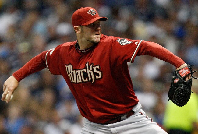 MILWAUKEE, WI - OCTOBER 02:  Micah Owings #15 of the Arizona Diamondbacks pitches against the Milwaukee Brewers during Game Two of the National League Division Series at Miller Park on October 2, 2011 in Milwaukee, Wisconsin.  (Photo by Jared Wickerham/Getty Images)