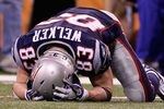 INDIANAPOLIS, IN - FEBRUARY 05:  Wes Welker #83 of the New England Patriots lays on the ground in the fourth quarter during Super Bowl XLVI at Lucas Oil Stadium on February 5, 2012 in Indianapolis, Indiana.  (Photo by Elsa/Getty Images)