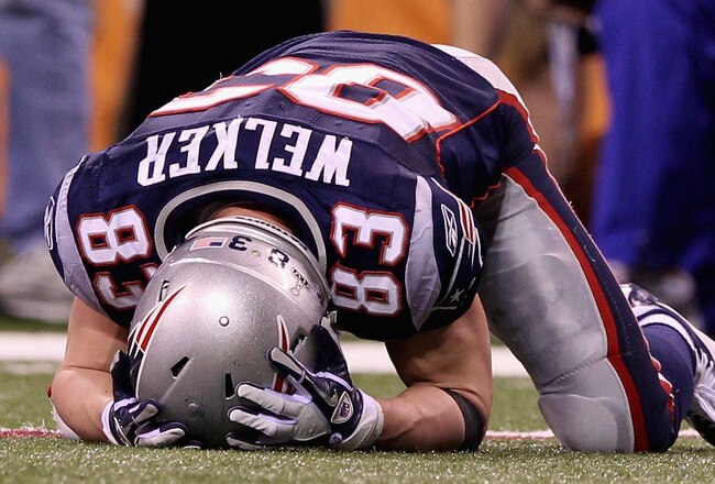 INDIANAPOLIS, IN - FEBRUARY 05:  Wes Welker #83 of the New England Patriots lays on the ground in the fourth quarter during Super Bowl XLVI at Lucas Oil Stadium on February 5, 2012 in Indianapolis, Indiana.  (Photo by Elsa/Getty Images)