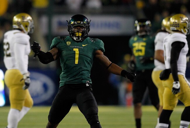 EUGENE, OR - DECEMBER 02:  Josh Huff #1 of the Oregon Ducks celebrates a long kick off return against  the UCLA Bruins  during the Pac 12 Championship Game on December 2, 2011 at the Autzen Stadium in Eugene, Oregon.  (Photo by Jonathan Ferrey/Getty Images)