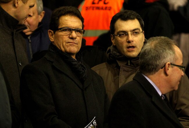 LIVERPOOL, ENGLAND - FEBRUARY 06:  England Manager Fabio Capello chats to Liverpool Director of Football Damien Comolli (R) prior to the Barclays Premier League match between Liverpool and Tottenham Hotspur at Anfield on February 6, 2012 in Liverpool, England. (Photo by Clive Brunskill/Getty Images)