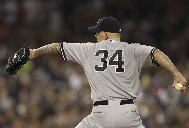DETROIT, MI - OCTOBER 04:  A J Burnett #34 of the New York Yankees pitches in the sixth inning during Game Four of the American League Divison Series against the Detroit Tigers at Comerica Park on October 4, 2011 in Detroit, Michigan. The Yankees defeated the Tigers 10-1.  (Photo by Leon Halip/Getty Images)