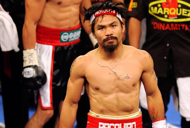 LAS VEGAS, NV - NOVEMBER 12:  Boxers Juan Manuel Marquez (L) and Manny Pacquiao appear in the ring before their WBO world welterweight title fight at the MGM Grand Garden Arena November 12, 2011 in Las Vegas, Nevada. Pacquiao retained his title with a majority decision victory.  (Photo by Ethan Miller/Getty Images)