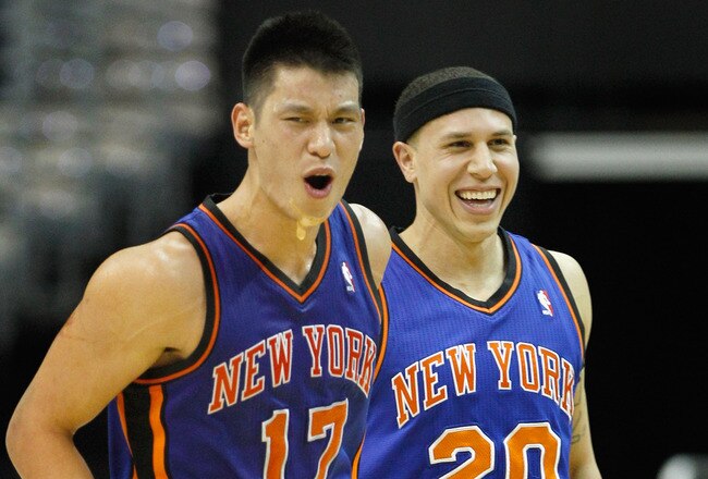 WASHINGTON, DC - FEBRUARY 08: Jeremy Lin #17 of the New York Knicks and Mike Bibby #20 celebrate after Lin scored against the Washington Wizards during the second half at Verizon Center on February 8, 2012 in Washington, DC. NOTE TO USER: User expressly acknowledges and agrees that, by downloading and or using this photograph, User is consenting to the terms and conditions of the Getty Images License Agreement.  (Photo by Rob Carr/Getty Images)