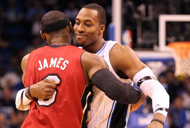 ORLANDO, FL - FEBRUARY 08:  LeBron James #6 of the Miami Heat hugs Dwight Howard #12 of the Orlando Magic during the game at Amway Center on February 8, 2012 in Orlando, Florida.   NOTE TO USER: User expressly acknowledges and agrees that, by downloading and or using this Photograph, user is consenting to the terms and conditions of the Getty Images License Agreement.  (Photo by Sam Greenwood/Getty Images)