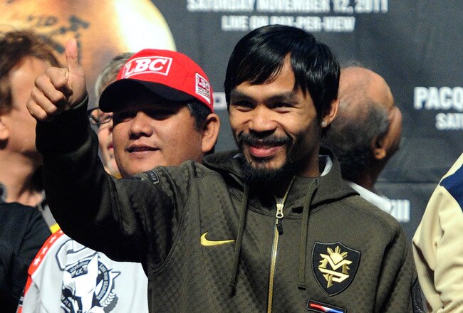 LAS VEGAS, NV - NOVEMBER 11:  Boxer Manny Pacquiao appears on stage during the official weigh-in for his bout against Juan Manuel Marquez at the MGM Grand Garden Arena November 11, 2011 in Las Vegas, Nevada. Pacquiao will defend his WBO welterweight title against Marquez when the two meet in the ring for the third time on November 12 in Las Vegas.  (Photo by Ethan Miller/Getty Images)