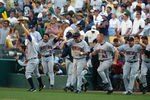 OAKLAND, CA - OCTOBER 6:  The bench of the Minnesota Twins celebrates after their 5-4 win over the Oakland Athletics during game five of the American League Western Division Series on October 6, 2002 at Network Associates Coliseum, in Oakland, California.  The Twins advanced to the American League Championship Series against the Anaheim Angels. (Photo by Donald Miralle/Getty Images)