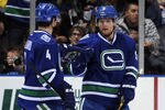 EDMONTON, CANADA - OCTOBER 25: Cody Hodgson #9 of the Vancouver Canucks celebrates his goal with teammate Keith Ballard #4 against the Edmonton Oilers on October 25, 2011 at the Rexall Place in Edmonton, Alberta, Canada. (Photo by Dale MacMillan/Getty Images)