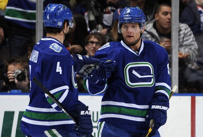 EDMONTON, CANADA - OCTOBER 25: Cody Hodgson #9 of the Vancouver Canucks celebrates his goal with teammate Keith Ballard #4 against the Edmonton Oilers on October 25, 2011 at the Rexall Place in Edmonton, Alberta, Canada. (Photo by Dale MacMillan/Getty Images)